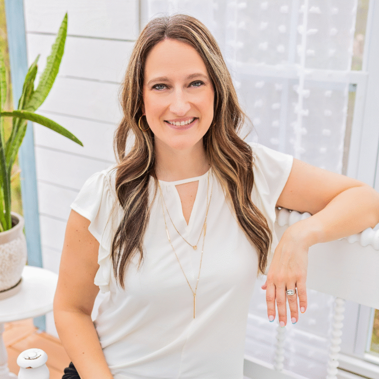 A woman smiling at camera.