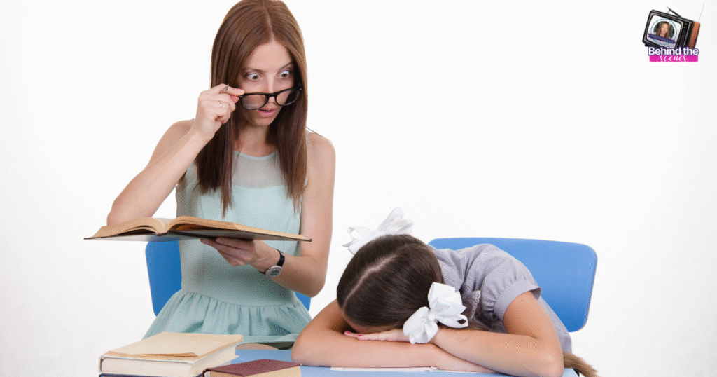 A female teacher holding a book looks surprised over her glasses at a young girl with bows in her hair, who has her head down on a desk next to books—perhaps daydreaming of jobs for teachers leaving education.