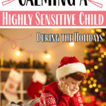 A young boy wearing a Santa hat and festive red sweater lies on the floor reading, with a Christmas tree and stockings in the background. Text reads: Calming a Highly Sensitive Child During the Holidays.