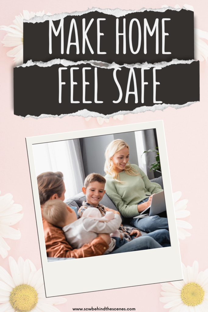 A family sits together on a couch; an adult and three children smile while looking at a laptop. The bold words "Make Home Feel Safe" highlight the cozy scene, framed with daisies and a pink backdrop.